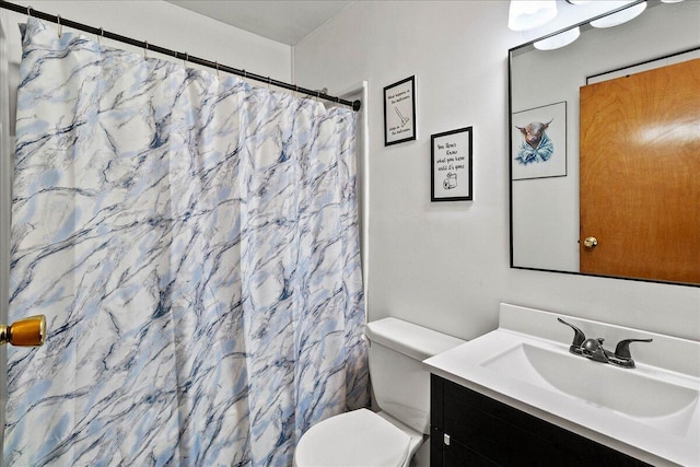 230 Morse St, Russells Point, OH 43348 - bathroom featuring vanity, toilet, and a shower with shower curtain