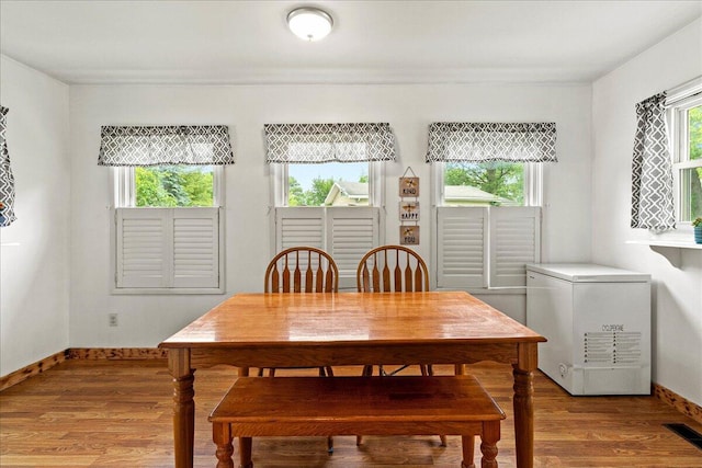 230 Morse St, Russells Point, OH 43348 - dining room featuring light wood-style flooring and baseboards