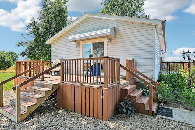 4711 N Elm Tree Rd, Conover, OH 45317 - back of property featuring a wooden deck and stairs