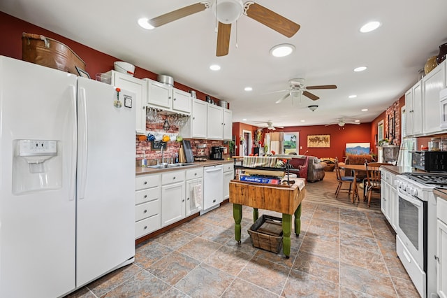 4711 N Elm Tree Rd, Conover, OH 45317 - kitchen with white appliances, a ceiling fan, recessed lighting, backsplash, and stone finish floors