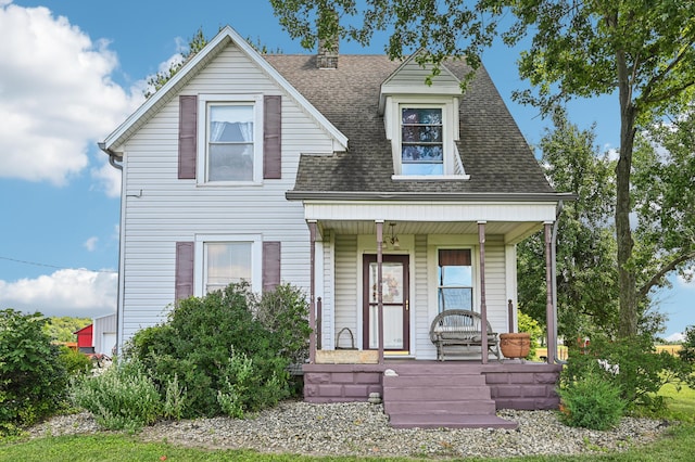 4711 N Elm Tree Rd, Conover, OH 45317 - view of front of house featuring covered porch and a shingled roof