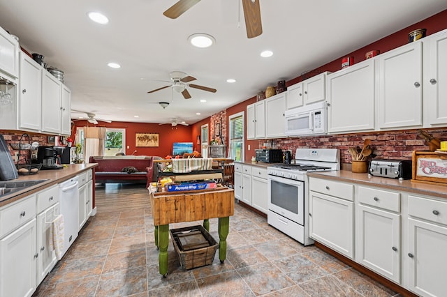 4711 N Elm Tree Rd, Conover, OH 45317 - kitchen featuring white appliances, ceiling fan, healthy amount of natural light, and recessed lighting