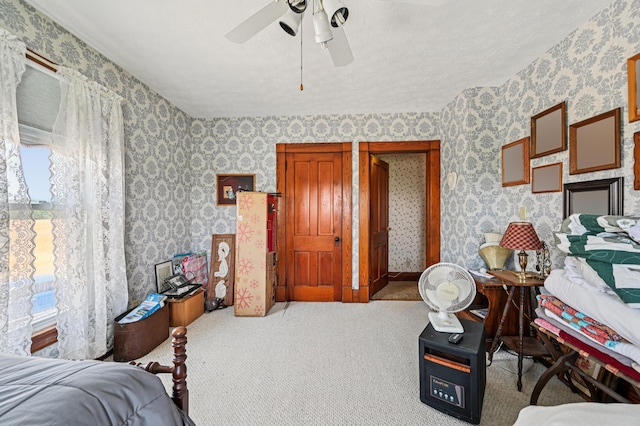 4711 N Elm Tree Rd, Conover, OH 45317 - carpeted bedroom featuring wallpapered walls, multiple windows, and ceiling fan