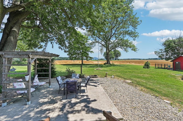 4711 N Elm Tree Rd, Conover, OH 45317 - view of patio / terrace with a view of rural / pastoral area and outdoor dining space