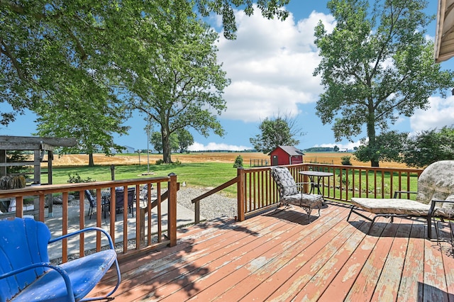 4711 N Elm Tree Rd, Conover, OH 45317 - wooden deck featuring a shed, a yard, and a view of countryside