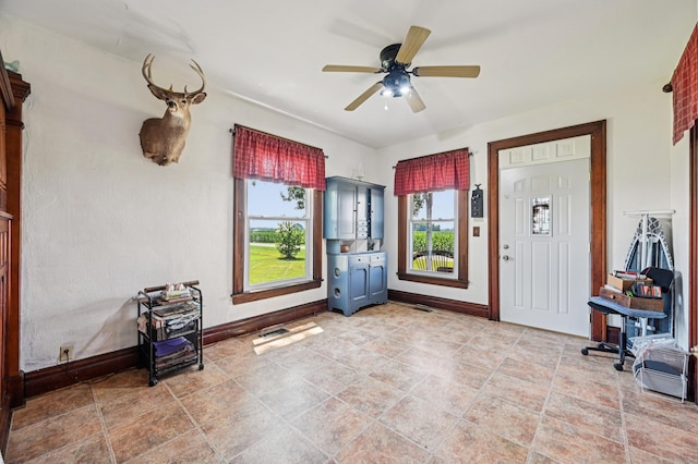 4711 N Elm Tree Rd, Conover, OH 45317 - foyer entrance featuring plenty of natural light and ceiling fan