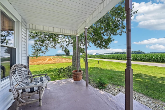 4711 N Elm Tree Rd, Conover, OH 45317 - view of patio / terrace featuring agricultural plots and a rural view