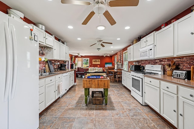 4711 N Elm Tree Rd, Conover, OH 45317 - kitchen with white appliances, a ceiling fan, recessed lighting, tasteful backsplash, and white cabinets