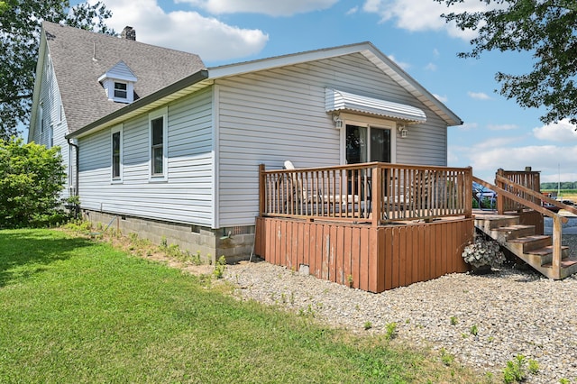 4711 N Elm Tree Rd, Conover, OH 45317 - back of house with a deck, a yard, and roof with shingles