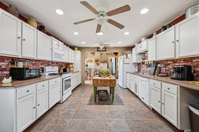 4711 N Elm Tree Rd, Conover, OH 45317 - kitchen featuring white appliances, a ceiling fan, decorative backsplash, white cabinets, and recessed lighting