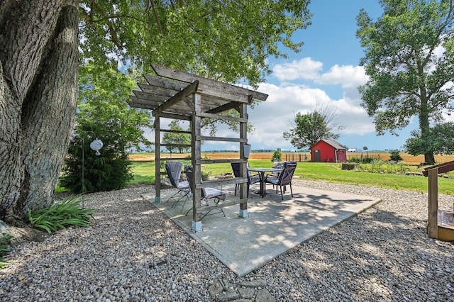 4711 N Elm Tree Rd, Conover, OH 45317 - view of patio with an outdoor structure and a pergola