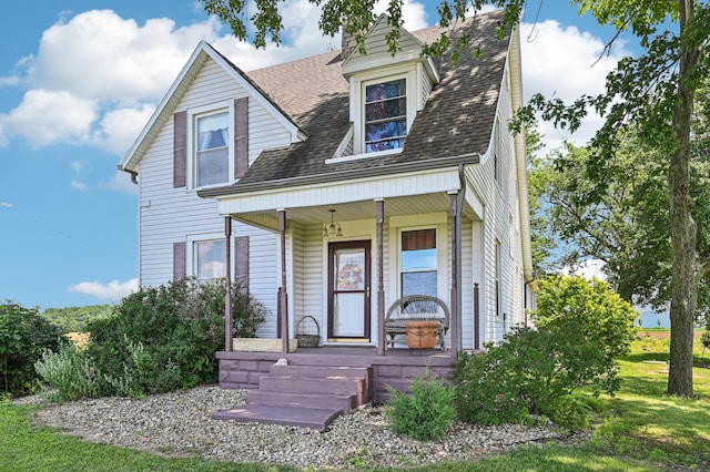 4711 N Elm Tree Rd, Conover, OH 45317 - view of front of property with a porch and a shingled roof