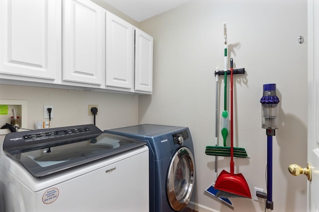 170 Fox Harbor Dr, Troy, OH 45373 - washroom featuring cabinet space and separate washer and dryer