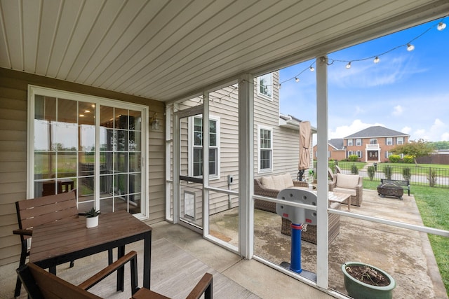 170 Fox Harbor Dr, Troy, OH 45373 - sunroom with a fire pit and outdoor dining area