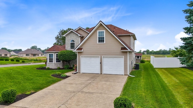 170 Fox Harbor Dr, Troy, OH 45373 - view of front of property featuring stone siding, concrete driveway, and an attached garage
