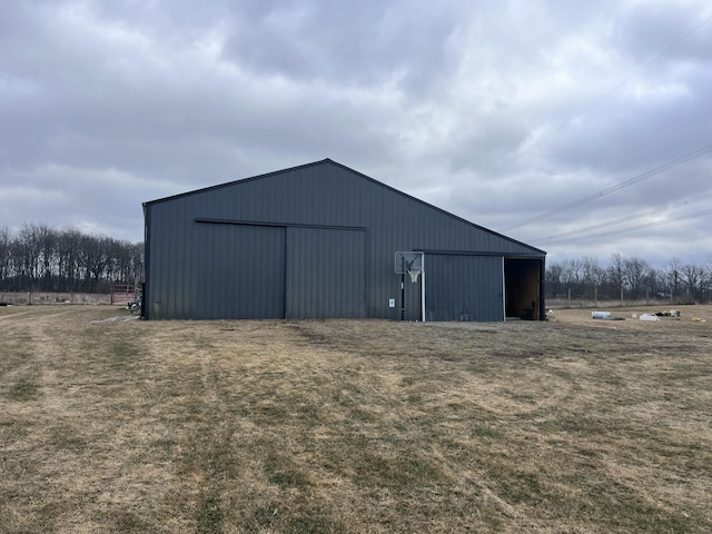 view of outbuilding with a yard