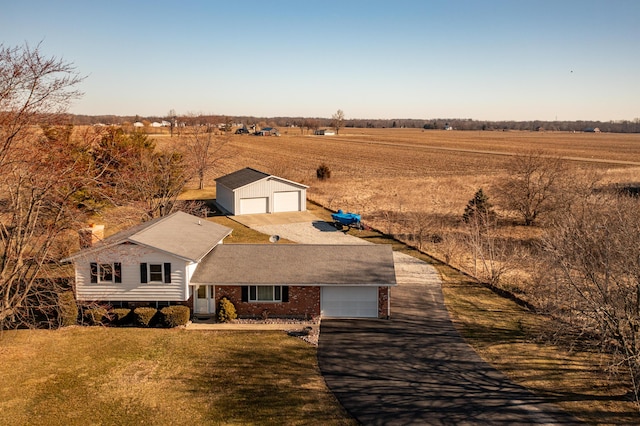 birds eye view of property with a rural view