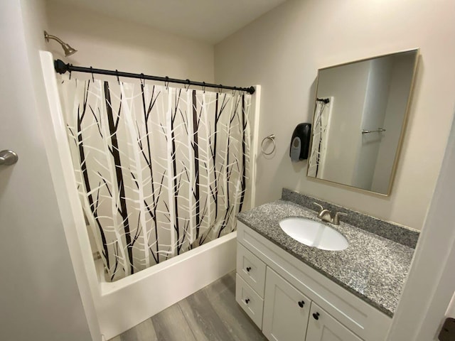 200 Malone Ave, Bellefontaine, OH 43311 - bathroom with wood finished floors, vanity, and shower / bath combo with shower curtain