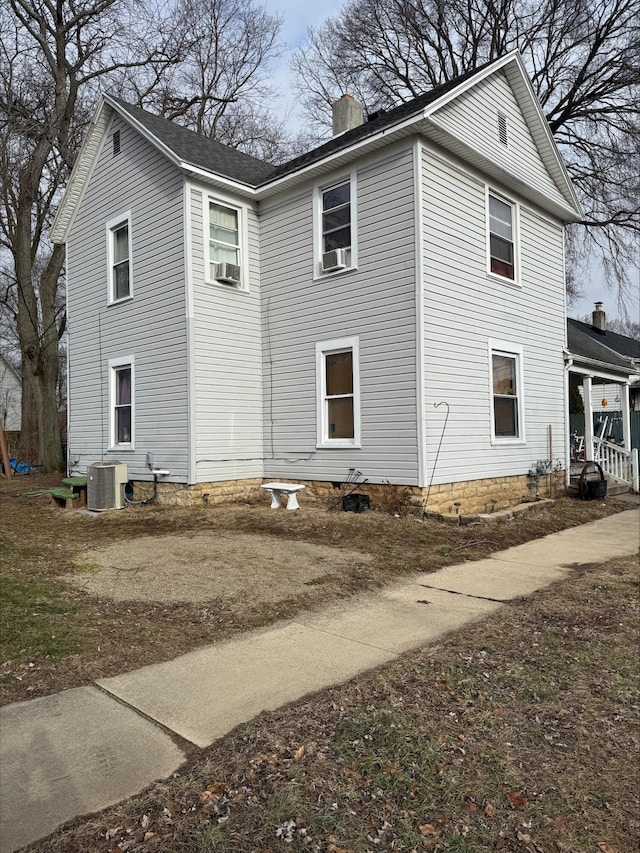 view of home's exterior with cooling unit