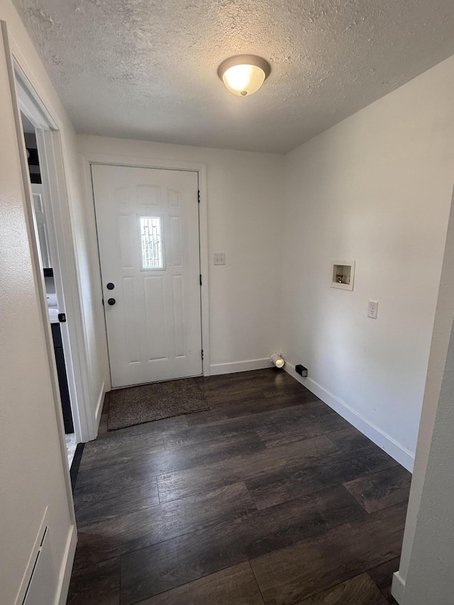 158 E Walnut St, Rockford, OH 45882 - laundry area with a textured ceiling, dark wood-style flooring, and hookup for a washing machine