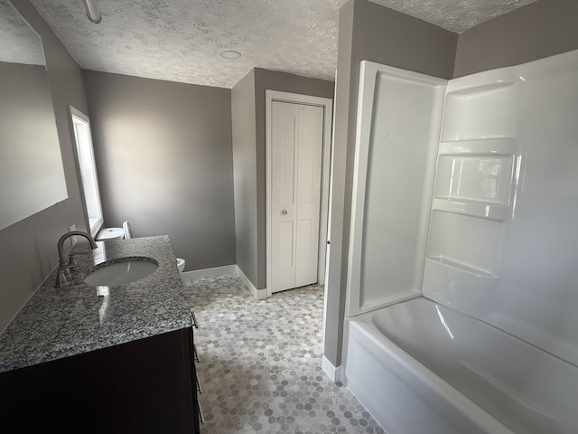 158 E Walnut St, Rockford, OH 45882 - bathroom with vanity, a textured ceiling, and washtub / shower combination