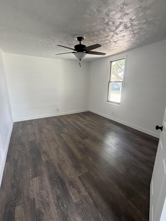 158 E Walnut St, Rockford, OH 45882 - empty room with dark wood-style flooring, ceiling fan, and a textured ceiling