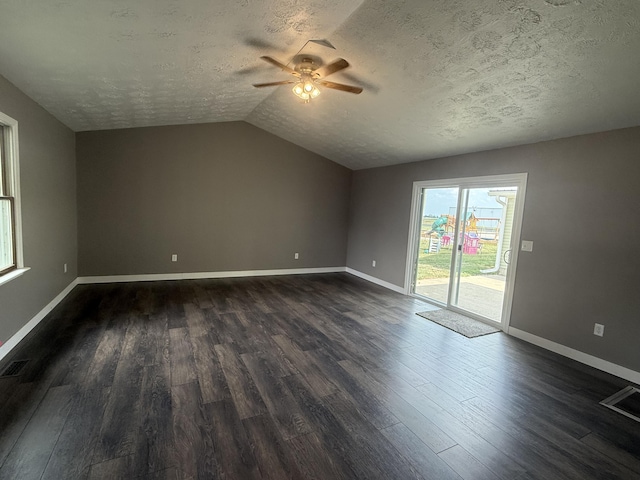 158 E Walnut St, Rockford, OH 45882 - empty room with ceiling fan, a textured ceiling, dark wood-style flooring, and vaulted ceiling