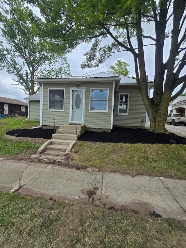 158 E Walnut St, Rockford, OH 45882 - bungalow-style house with entry steps and a metal roof
