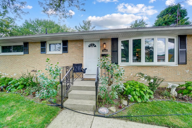 view of front of home featuring brick siding