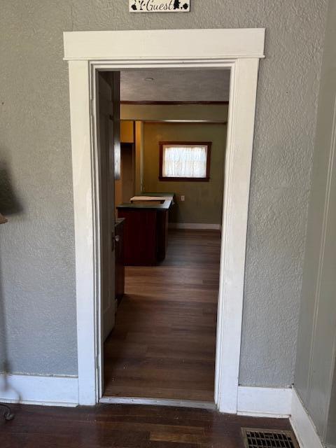 hall featuring visible vents