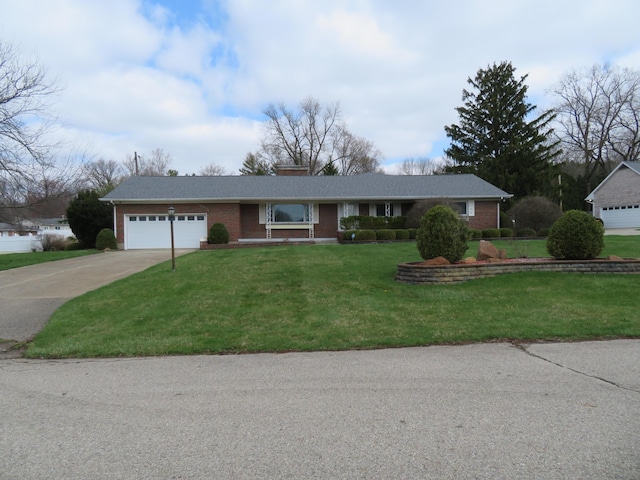 ranch-style house with driveway, a front yard, a garage, and brick siding