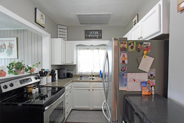 1508 Nicklin Ave, Piqua, OH 45356 - kitchen featuring stainless steel appliances and white cabinetry