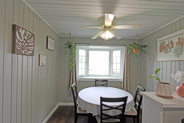 1508 Nicklin Ave, Piqua, OH 45356 - dining room with dark wood finished floors, ornamental molding, a ceiling fan, and wood walls