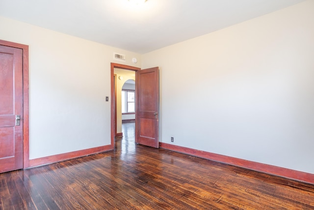 empty room featuring dark hardwood / wood-style floors