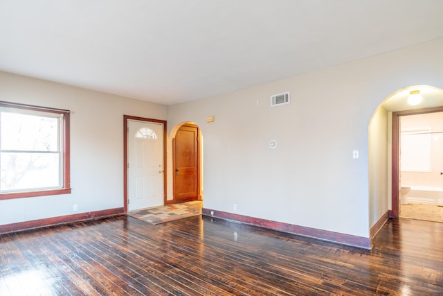 spare room with dark hardwood / wood-style floors