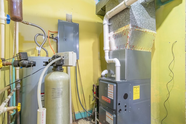 utility room featuring heating unit