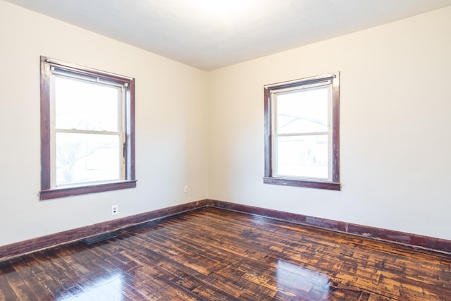 spare room featuring hardwood / wood-style flooring