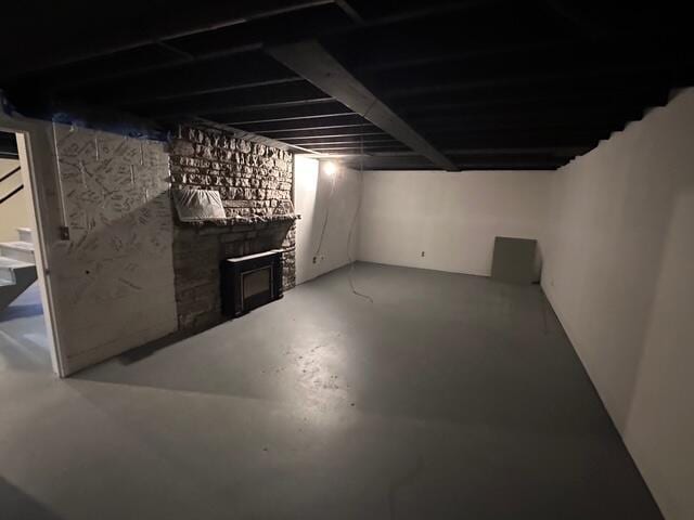 finished basement with a fireplace