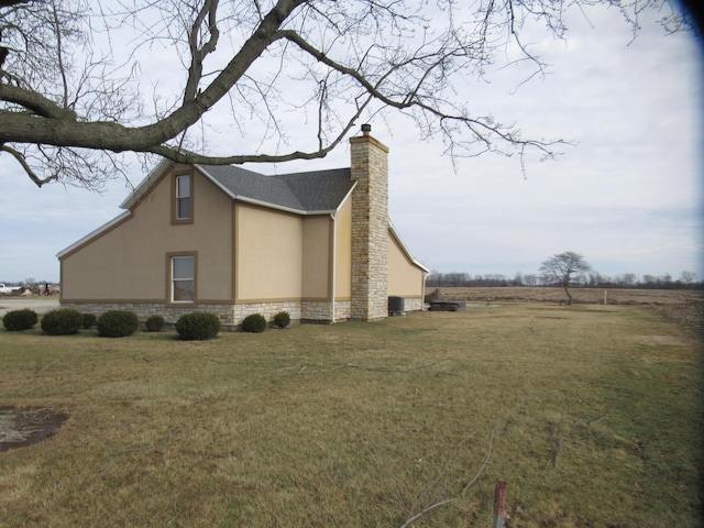 view of home's exterior featuring a lawn