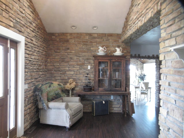 unfurnished room with lofted ceiling and dark hardwood / wood-style floors