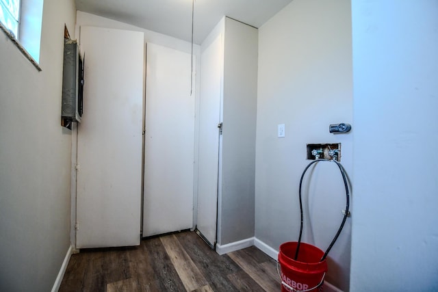 washroom with washer hookup, laundry area, wood finished floors, and baseboards