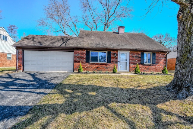 ranch-style house featuring a front lawn, driveway, an attached garage, brick siding, and a chimney