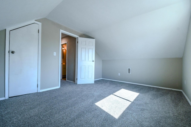 bonus room featuring carpet floors, baseboards, and vaulted ceiling