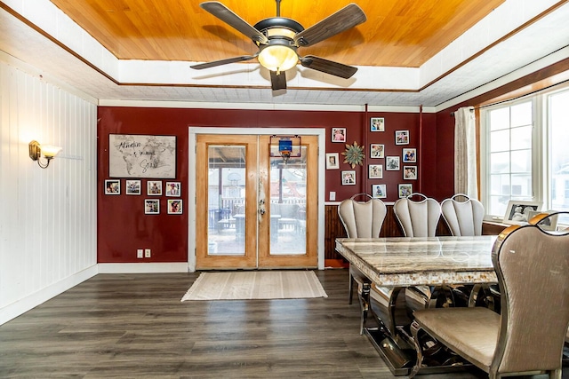 dining area with french doors, wooden ceiling, and a raised ceiling