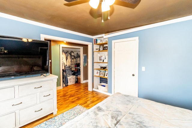 bedroom with a ceiling fan and light wood finished floors