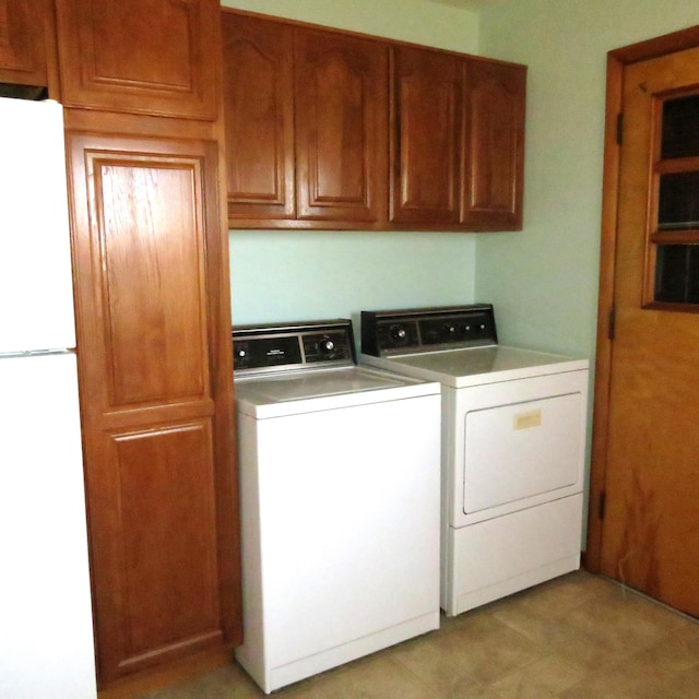 laundry room with cabinet space and independent washer and dryer