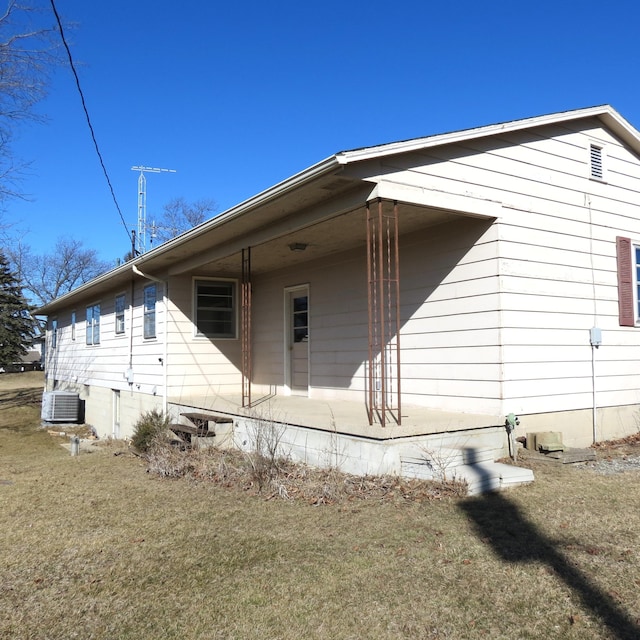 back of property featuring central AC unit