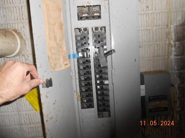 utility room featuring electric panel