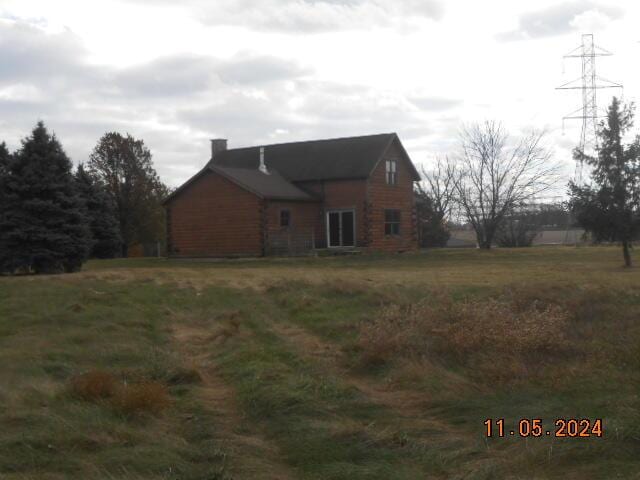 view of side of property featuring a chimney