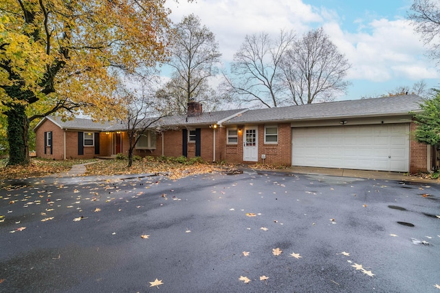 single story home featuring a garage